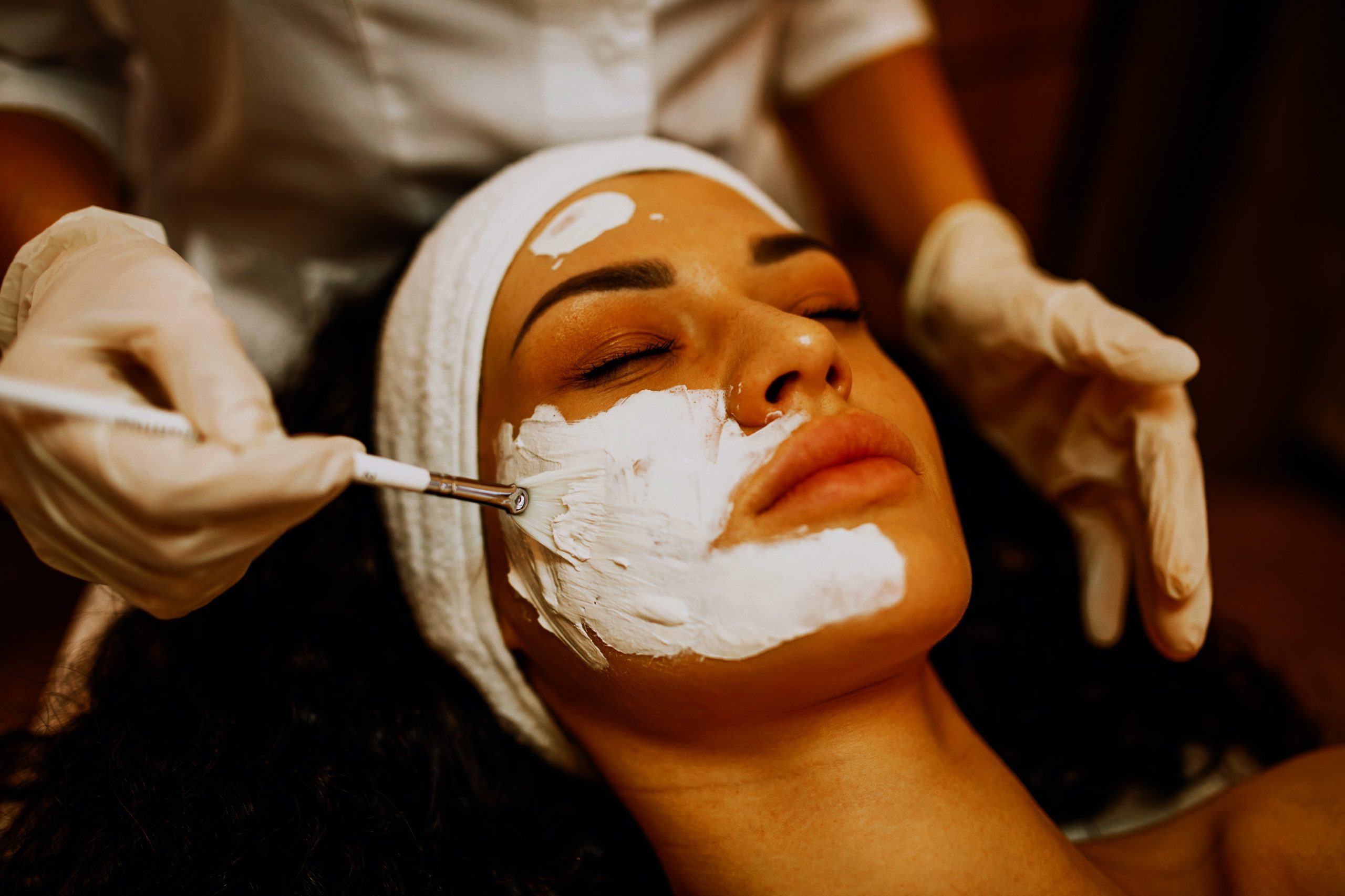 Woman visiting cosmetologist and making rejuvenation procedures